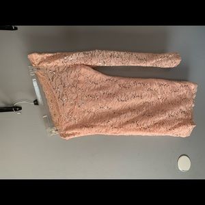 One sleeve, form fitting dress. Only wore once! It’s a lighter pink.